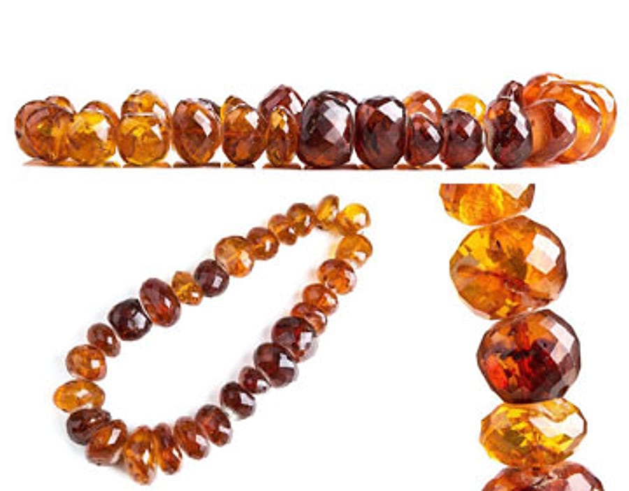 A strand of large faceted amber beads in honey and cognac tones, the typical single-strand large-bead build of the Bückeburg Kralln